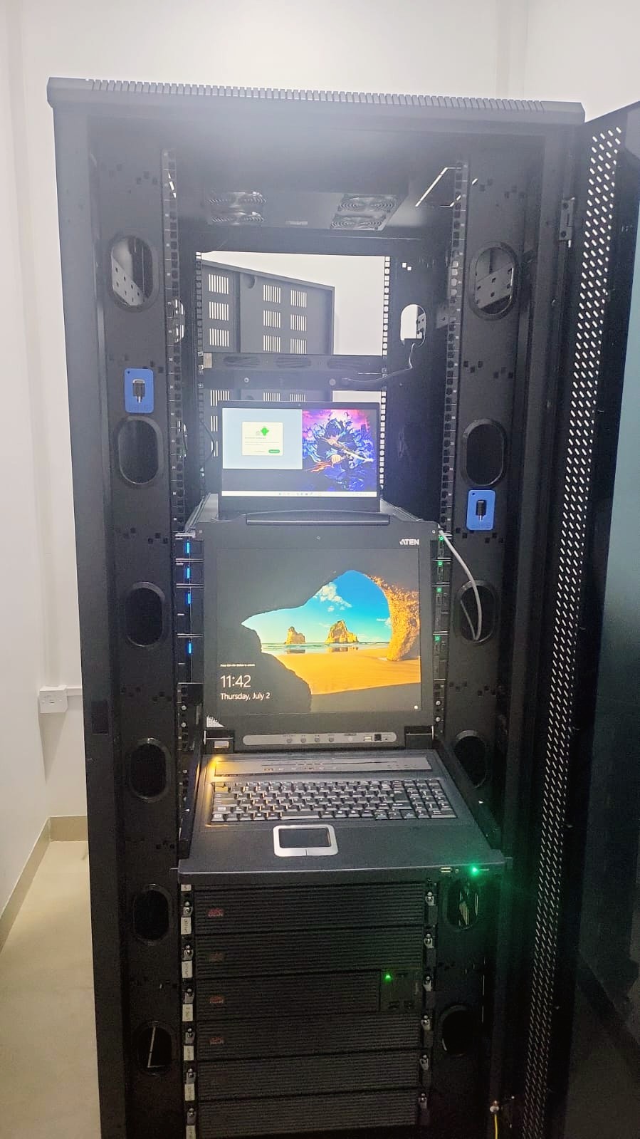 ATEN KVM console pulled out with monitor and keyboard for server administration