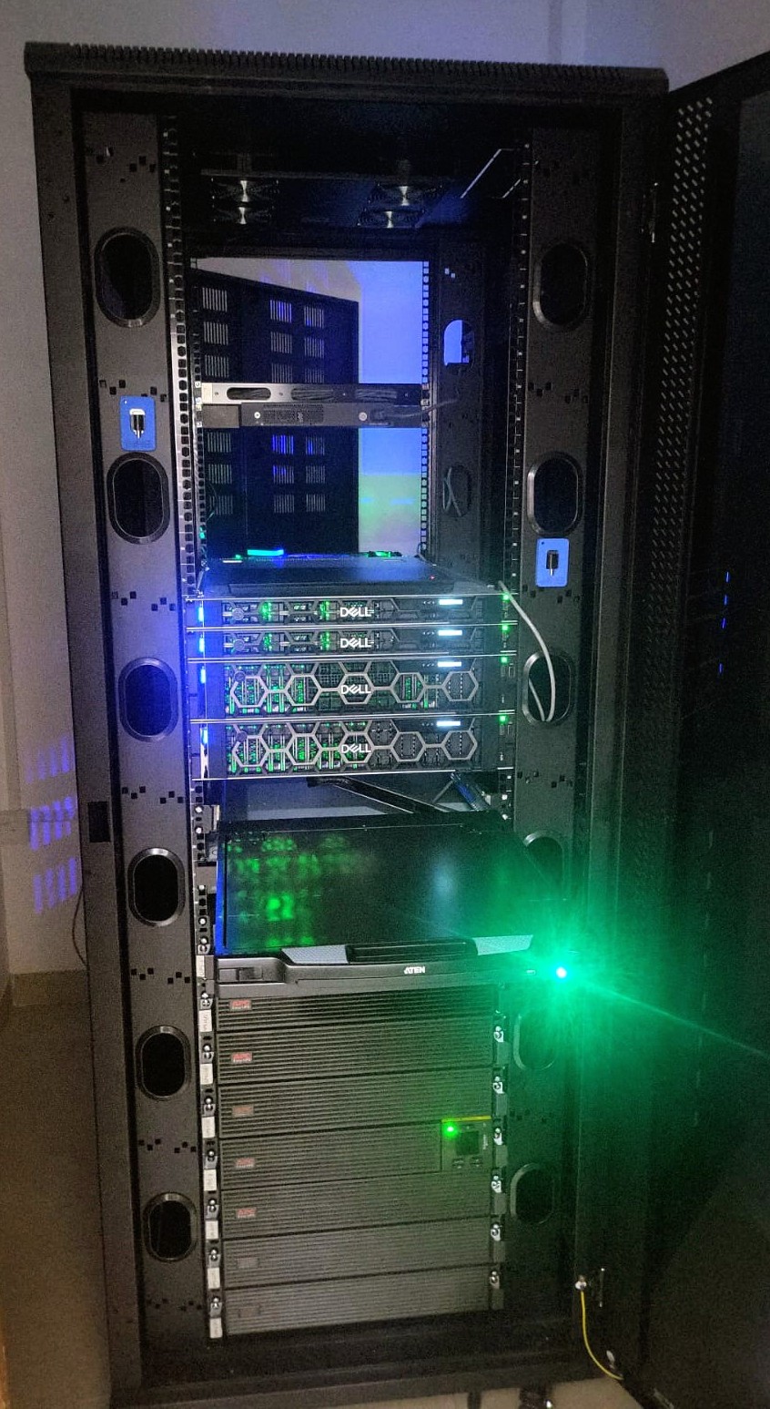 Fully populated server rack with Dell servers, network switch, and rack PDUs